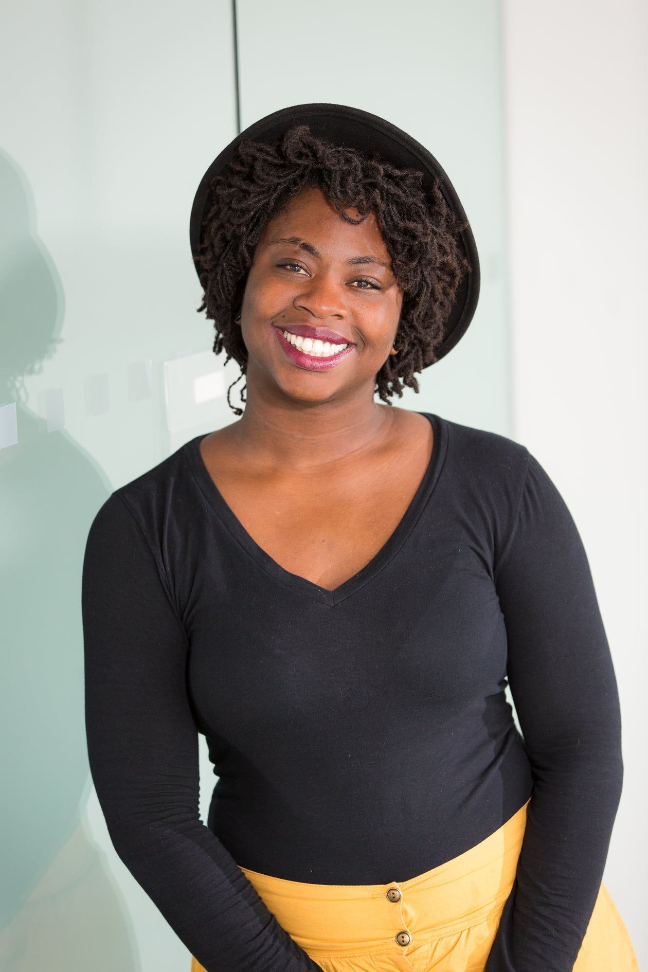 A Black woman — present, confident, sovereign.