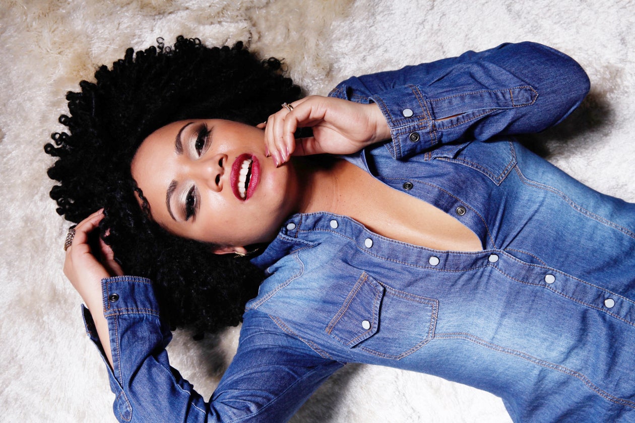 A Black woman — present, confident, sovereign.